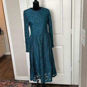 Long sleeve teal lace midi dress.